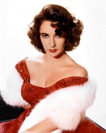 Elizabeth Taylor in red dress and fur., 1955? (Studio publicity still/USPD.pub.date, cr lapsed/Commons.wikimedia.org)